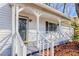 Inviting covered front porch with white railings, offering a cozy entrance to the home and adding to its curb appeal at 3661 Silver Leaf Sw Ln, Marietta, GA 30008