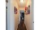 Hallway with dark hardwood floors and Gathering pictures at 3661 Silver Leaf Sw Ln, Marietta, GA 30008