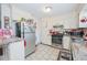 A functional kitchen featuring appliances, ample counter space, and tile flooring at 3661 Silver Leaf Sw Ln, Marietta, GA 30008