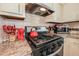 Close-up of kitchen stove with stainless steel appliances and a red kettle at 3661 Silver Leaf Sw Ln, Marietta, GA 30008
