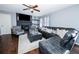Spacious living room featuring hardwood floors, a cozy fireplace, and ample seating with a seamless layout at 3661 Silver Leaf Sw Ln, Marietta, GA 30008