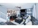 Spacious living room featuring hardwood floors, a cozy fireplace, and ample seating with a seamless layout at 3661 Silver Leaf Sw Ln, Marietta, GA 30008