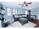 Spacious living room featuring hardwood floors, a cozy fireplace, and ample seating with a seamless layout at 3661 Silver Leaf Sw Ln, Marietta, GA 30008
