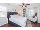 Well-lit bedroom featuring wood flooring, a seating area, and large windows at 3661 Silver Leaf Sw Ln, Marietta, GA 30008