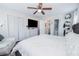 Spacious bedroom featuring a TV, dresser, closet, and plenty of natural light at 3661 Silver Leaf Sw Ln, Marietta, GA 30008