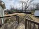 View of a large backyard from a wooden deck, perfect for outdoor activities at 4749 Cox Se St, Acworth, GA 30101