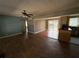 Spacious living room featuring hardwood floors, ceiling fan, and natural light at 4749 Cox Se St, Acworth, GA 30101