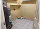 A utility room features tile flooring and essential appliances at 4749 Cox Se St, Acworth, GA 30101