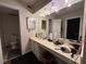 Spacious bathroom featuring a wide countertop, illuminated mirror, and a separate toilet area at 62 Place Fontaine, Lithonia, GA 30038