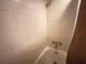 Standard tiled bathtub with shower at 62 Place Fontaine, Lithonia, GA 30038