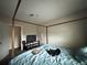Bedroom with a canopy bed, providing a serene retreat at 62 Place Fontaine, Lithonia, GA 30038