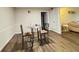 Dining area featuring modern table and chairs, with seamless access to the living area at 62 Place Fontaine, Lithonia, GA 30038