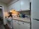 Functional kitchen with white appliances, granite countertops, offering space for culinary creativity at 62 Place Fontaine, Lithonia, GA 30038
