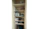 Organized linen closet showcasing neatly folded towels and blankets on multiple shelves at 62 Place Fontaine, Lithonia, GA 30038