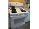 White GE oven range with electric burners and above mounted control panel at 62 Place Fontaine, Lithonia, GA 30038