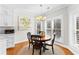 Cozy breakfast nook with a round table, chairs, a painting, and bright natural light at 105 Leisure Trl, Peachtree City, GA 30269