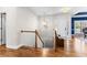 Inviting entryway features hardwood floors, staircase, and a bright white front door for a welcoming ambiance at 105 Leisure Trl, Peachtree City, GA 30269
