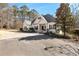 Charming single-story home with white siding, dark shutters, and a welcoming front porch with rocking chairs at 105 Leisure Trl, Peachtree City, GA 30269