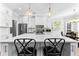 Bright kitchen boasting an island with seating, sleek countertops, and stainless steel appliances and breakfast nook at 105 Leisure Trl, Peachtree City, GA 30269