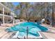 Sparkling backyard pool features a slide and ample space for relaxation and recreation at 105 Leisure Trl, Peachtree City, GA 30269