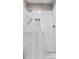 Close up of walk-in shower with white subway tile, glass door, rain shower head, and tiled built-in niche at 105 Leisure Trl, Peachtree City, GA 30269