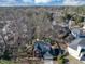 Overhead view showing a home in a wooded neighborhood with fenced backyard and mature trees at 1098 Berkley Se Dr, Smyrna, GA 30082