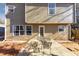 Backyard features outdoor seating area and exterior of home at 1098 Berkley Se Dr, Smyrna, GA 30082