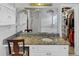 Bathroom vanity and mirror with views of soaker tub and walk-in closet at 1098 Berkley Se Dr, Smyrna, GA 30082