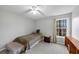 Simple bedroom with carpet, natural lighting, and small bedside table with drawers at 1098 Berkley Se Dr, Smyrna, GA 30082
