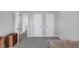 Neutral bedroom features two closets, open doorway, and gray carpet at 1098 Berkley Se Dr, Smyrna, GA 30082