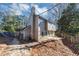 Rear exterior elevation features patio area, and trees at 1098 Berkley Se Dr, Smyrna, GA 30082