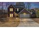 Charming two-story home featuring a brick facade, attached garage, and well-maintained landscaping at 1098 Berkley Se Dr, Smyrna, GA 30082