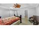 Light-filled main bedroom features ceiling fan, bed and sitting area at 1098 Berkley Se Dr, Smyrna, GA 30082