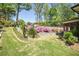 Beautiful backyard with stone retaining wall, lush landscaping, and plenty of green space at 2922 Parkridge Ne Dr, Brookhaven, GA 30319