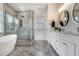 Elegant bathroom with a glass-enclosed shower, herringbone tile flooring, dual sinks, and ample counter space at 2922 Parkridge Ne Dr, Brookhaven, GA 30319