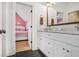 Modern bathroom with black and white tiled floors, white cabinets, and marble countertop at 2922 Parkridge Ne Dr, Brookhaven, GA 30319