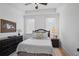 Cozy bedroom with natural light, neutral decor, and comfortable furnishings with an area rug at 2922 Parkridge Ne Dr, Brookhaven, GA 30319