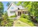 Charming two-story home with gray siding, a welcoming front porch, and lush landscaping at 2922 Parkridge Ne Dr, Brookhaven, GA 30319