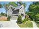 Two-story home with gray siding, a two car garage, and a well-maintained lawn at 2922 Parkridge Ne Dr, Brookhaven, GA 30319