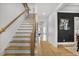 Bright foyer with hardwood floors, staircase, and decorative accents, showcasing a welcoming entrance at 2922 Parkridge Ne Dr, Brookhaven, GA 30319