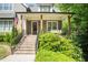 Inviting front porch featuring a porch swing, wooden columns, and a well-manicured lawn at 2922 Parkridge Ne Dr, Brookhaven, GA 30319