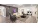 Finished basement living room with luxury vinyl plank floors, modern decor, and an exercise room at 2922 Parkridge Ne Dr, Brookhaven, GA 30319