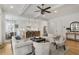 Open living room with modern decor, flowing into a kitchen with island seating and a breakfast nook at 2922 Parkridge Ne Dr, Brookhaven, GA 30319