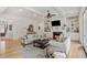 Bright living room with built-in shelving, a cozy fireplace, and hardwood floors at 2922 Parkridge Ne Dr, Brookhaven, GA 30319