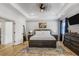 Serene main bedroom featuring a tray ceiling, stylish furnishings, and ample natural light at 2922 Parkridge Ne Dr, Brookhaven, GA 30319