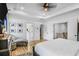 Bright main bedroom with light wood floors, featuring a sitting area, closet, and ensuite bathroom at 2922 Parkridge Ne Dr, Brookhaven, GA 30319