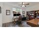 Bright home office with a large window, ceiling fan, hardwood floors, and a built-in bookcase at 2922 Parkridge Ne Dr, Brookhaven, GA 30319
