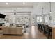 Open floor plan connecting the living room and kitchen with hardwood flooring and bright lighting at 2922 Parkridge Ne Dr, Brookhaven, GA 30319