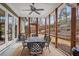 Screened porch with durable carpet, dining table, and outdoor view at 2922 Parkridge Ne Dr, Brookhaven, GA 30319