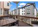 Inviting balcony with wood flooring, and dark wood railings, overlooking complex at 1029 Emory Parc Pl, Decatur, GA 30033